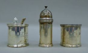 A three-piece silver cruet set bearing the Minto-Elliot crest. The pepper 8.5 cm high. 210 grammes.