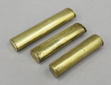 Three antique brass gunpowder/shot measures. The largest 10.5 cm long.
