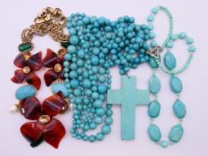 A quantity of various jewellery. The cross pendant 9 cm high.
