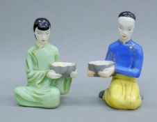 A pair of Chinese porcelain figures. Each 21.5 cm high.