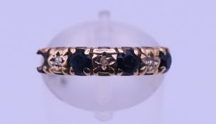A diamond and sapphire ring (lacking one stone). Ring size H/I. 2.1 grammes total weight.
