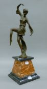 An Art Deco-style bronze model of a dancing girl on a marble plinth base. 46.5 cm high.