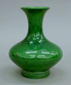 A Chinese green-glazed porcelain vase. 14 cm high.