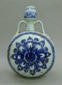 A Chinese blue and white porcelain moon vase. 33 cm high.