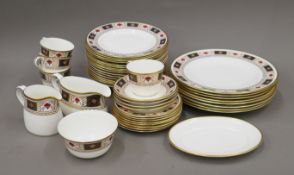 A quantity of Royal Crown Derby Derby Border pattern tea and dinner wares. The sauce boat 19.