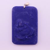 A silver-topped pendant. 6.5 cm high including suspension loop.