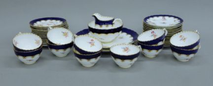 A Coalport ten-piece painted porcelain tea set. The cups each 9 cm diameter.