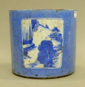 A Chinese blue and white porcelain brush pot. 17 cm high.
