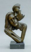 An abstract bronze model of lovers. 29 cm high.