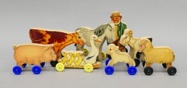 A 1950's Chad Valley plywood farm set. The cow 12 cm long.