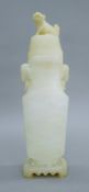 A Chinese white jade vase on stand. 37.5 cm high.