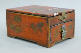 A Chinese red lacquered dressing table box. 11.5 cm wide.