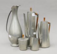 A vintage Dutch pewter coffee set and vase. The latter 33 cm high.