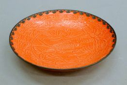 A Chinese white metal-rimmed pottery bowl decorated with fish. 2 1 cm diameter.