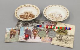Two Bruce Bairnsfather porcelain bowls, a small quantity of World War I postcards,