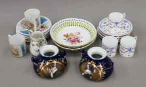 A quantity of German porcelain, including Sitzendorf cups and saucers. The jug 7 cm high.