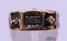 A Victorian 18 ct gold and enamel mourning ring. 4 grammes total weight. Ring size N.