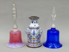 A metal-mounted porcelain vase and two glass bells (lacking clangers). The larger bell 39 cm high.