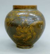 A Chinese brown pottery vase. 19 cm high.