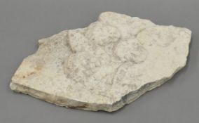 A composite stone plaque depicting angels. 43 cm long.