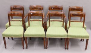 A set of eight 19th century brass-inlaid rope-back mahogany dining chairs, including two with arms.