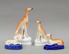 Four various Victorian Staffordshire porcelain greyhounds. The largest 32.5 cm high.
