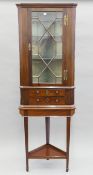 A George III and later mahogany corner cabinet on stand. 62 cm wide x 187 cm high.