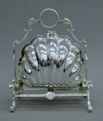 A silver-plated shell-form biscuit box. 23 cm high.