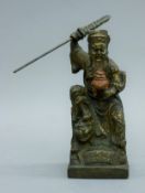 A Chinese bronze model of a warrior. 22 cm high.