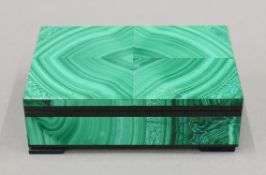 A malachite box. 12 cm wide.