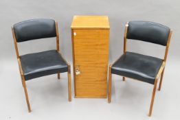Two mid-century Danish chairs and a mid- century Danish cupboard. The latter 80 cm wide.