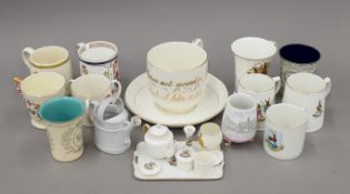 A quantity of crested and commemorative porcelain and enamel wares. The largest cup 11 cm high.