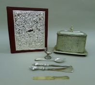 A sterling silver-mounted book, a plated biscuit box,