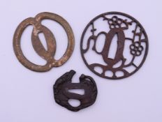 Three Japanese tsubas. The largest 8.5 cm diameter.