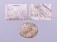 Three 19th century Chinese mother-of-pearl plaques. The oval example 4 cm wide.