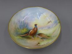 A Minton porcelain bowl painted with pheasants. 28 cm diameter.