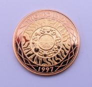 A boxed 22 ct gold proof £2 coin. 15.9 grammes.