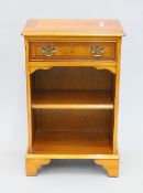 A modern yew wood veneered side cupboard. 46.5 cm wide.