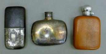 Three hip flasks. The largest 14 cm high.