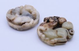 Two jade roundels. The larger 5 cm diameter.