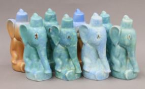 A collection of pottery elephants. Each 19 cm high.