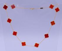 A silver gilt and carnelian cloverleaf necklace. 45 cm long.