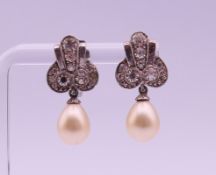 A pair of boxed Ciro pearl earrings. Each 2.2 cm high.