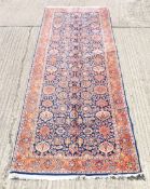 A Persian hand-knotted Kashan carpet. 371 x 131 cm.