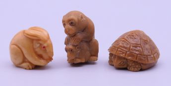 A monkey-form netsuke and two small animal carvings. The former 3.5 cm high.
