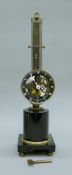A bronze and marble swing clock. 47 cm high.