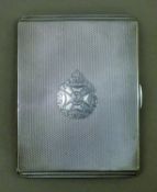 A silver cigarette case with 60th Rifles insignia engraved to front,