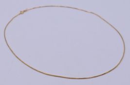 An 18 ct gold chain. 44 cm long.