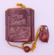 A wooden inro. 7.5 cm high.