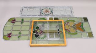 Four various pieces of leaded stained glass, one framed. The latter 57.5 x 51.5 cm overall.